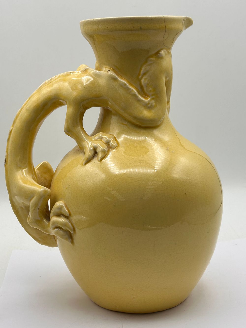 Lot 383: A 20th Century East Asian Tang Style Yellow Glazed Dragon Handle Ewer, 10 inches, Damaged