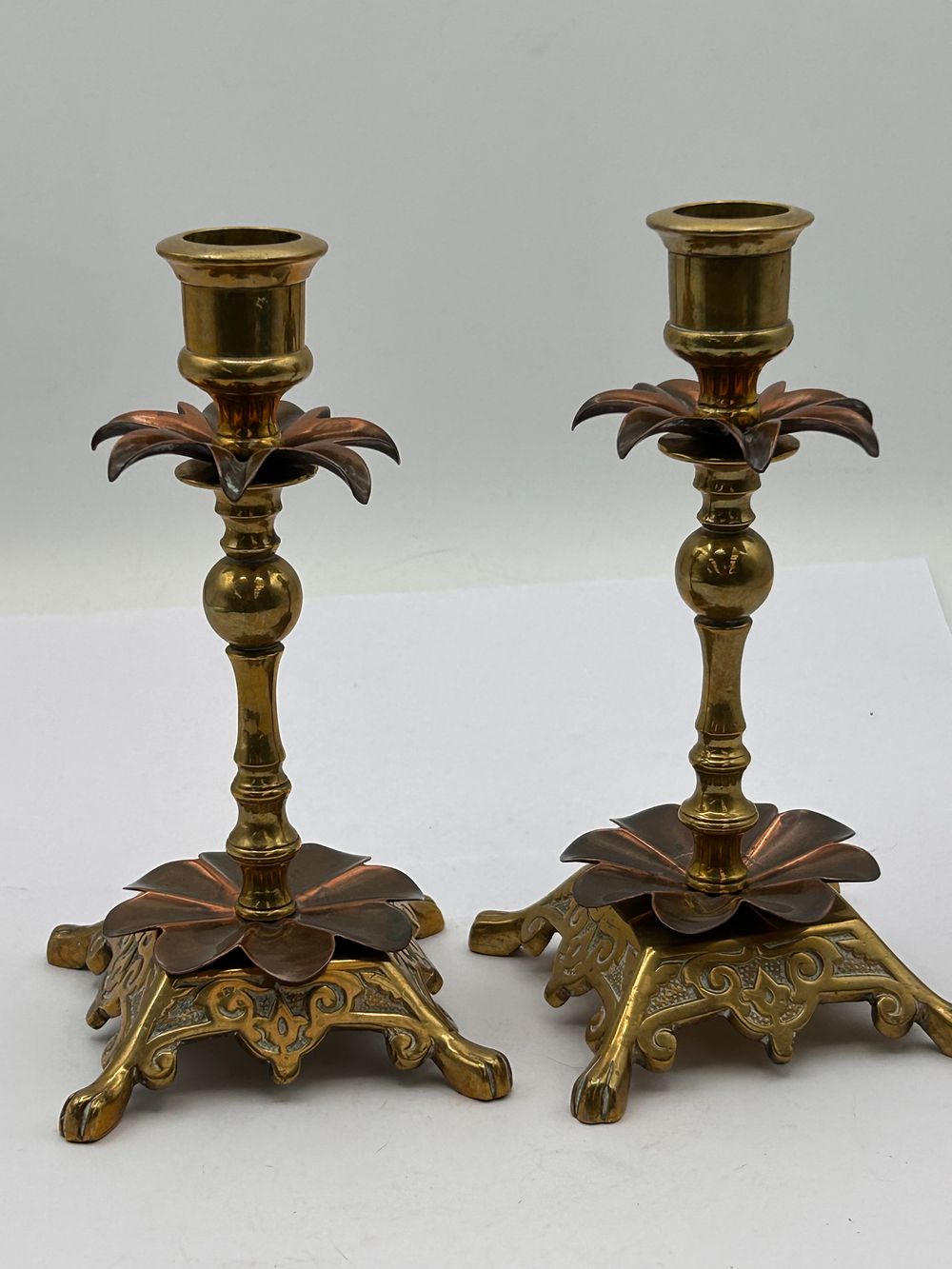 Lot 391: A Pair of Arts & Crafts Style Brass and Copper Candlesticks