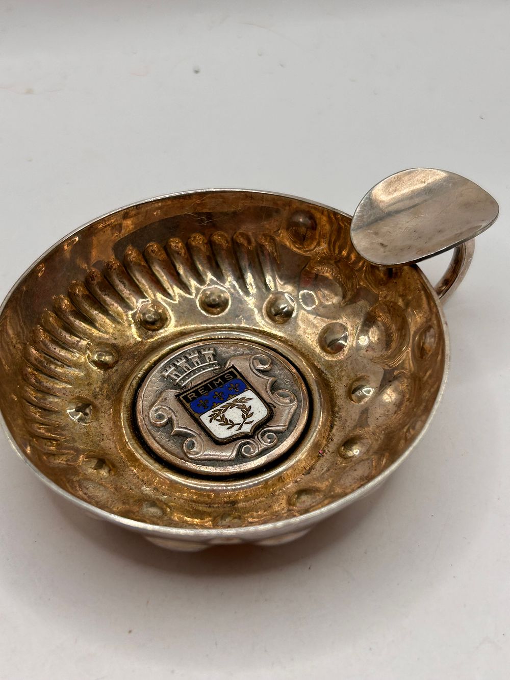 Lot 398: A Silver Plate French Tastevin with Reims Coat of Arms
