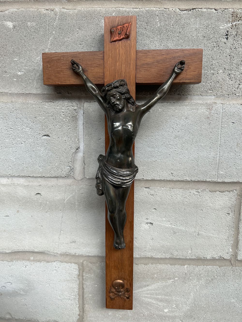 Lot 429: A Patinated Metal and Wood Wall Crucifix, 19.5 x 10.5 inches
