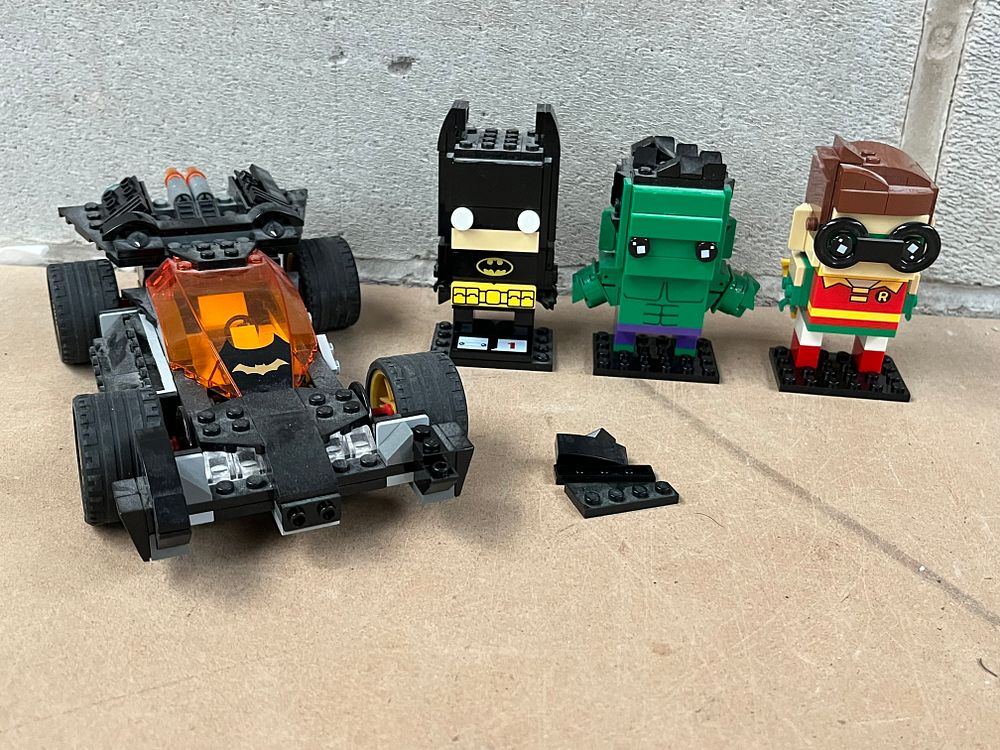 Lot 449: A Group of LEGO DC Comics Super Heroes, including a Batmobile from Set 76012 and Three BrickHeadz Figures