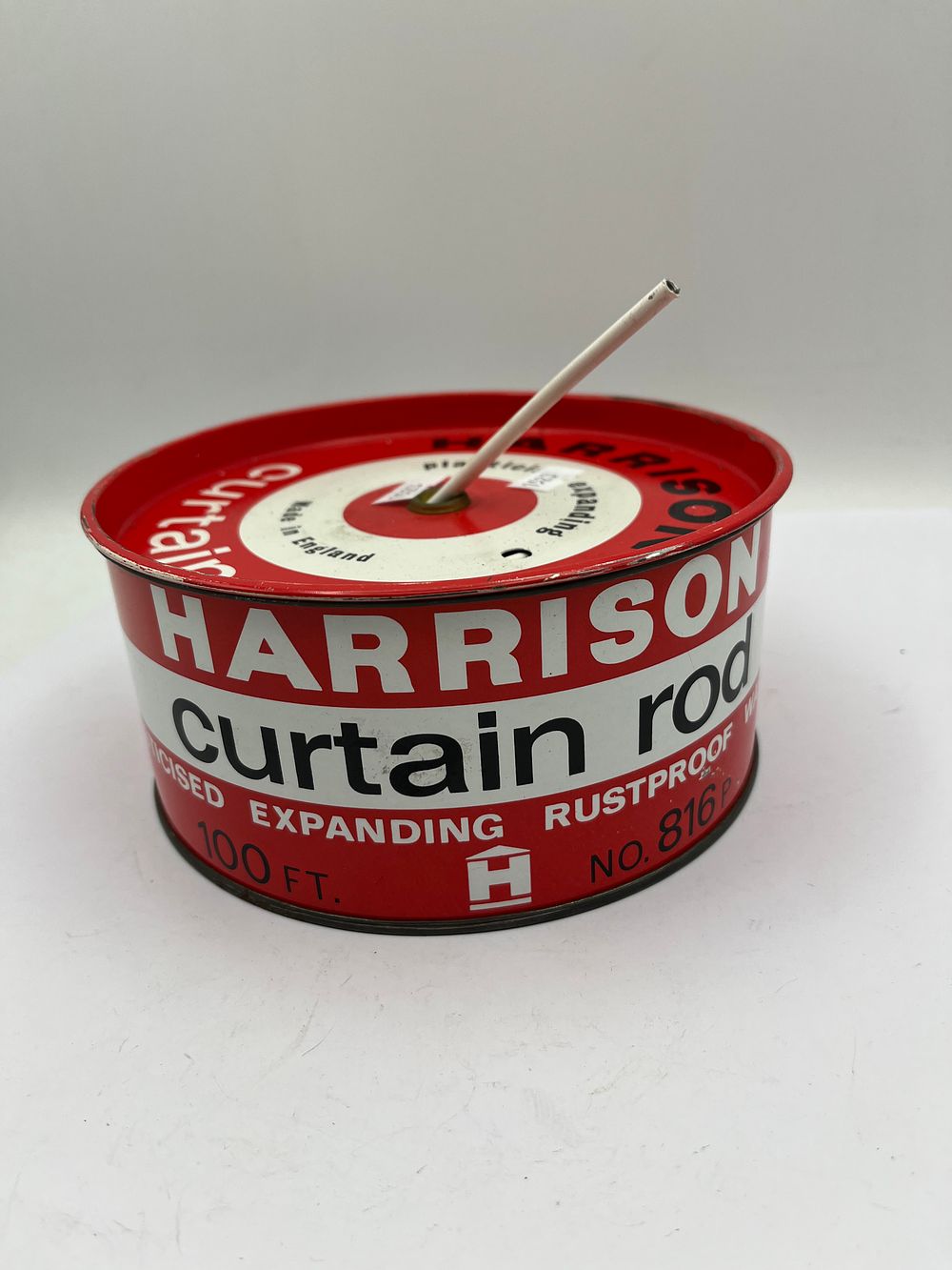 Lot 450: A Vintage Harrison Curtain Rod Tin