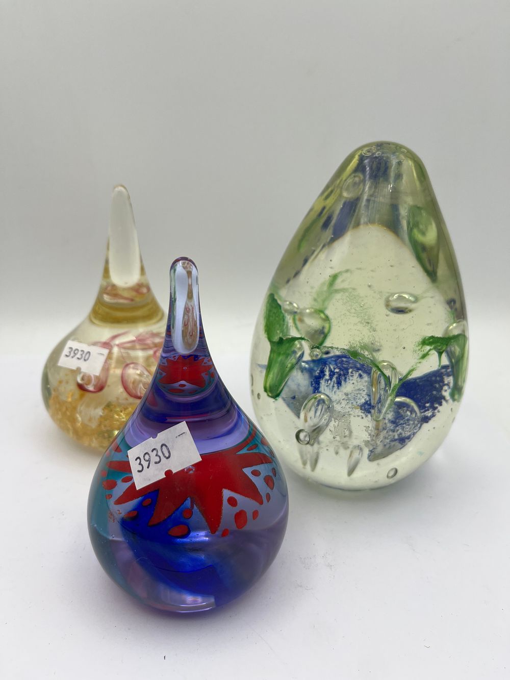 Lot 472: A Group of Three Art Glass Paperweights, including a Pair Attributed to Adam Jablonski