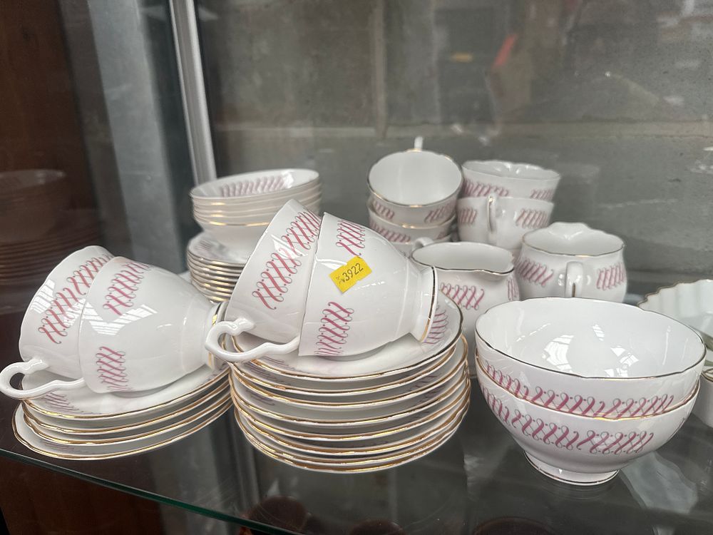 Lot 480: A Partial Set of Royal Stafford 'Lyric' Bone China Dinnerware and a Collection of Cast Metal Figurines