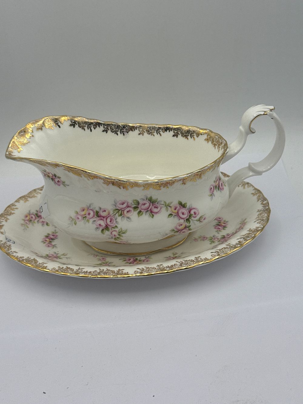 Lot 483: A Royal Albert Dimity Rose Bone China Gravy Boat with Integral Underplate