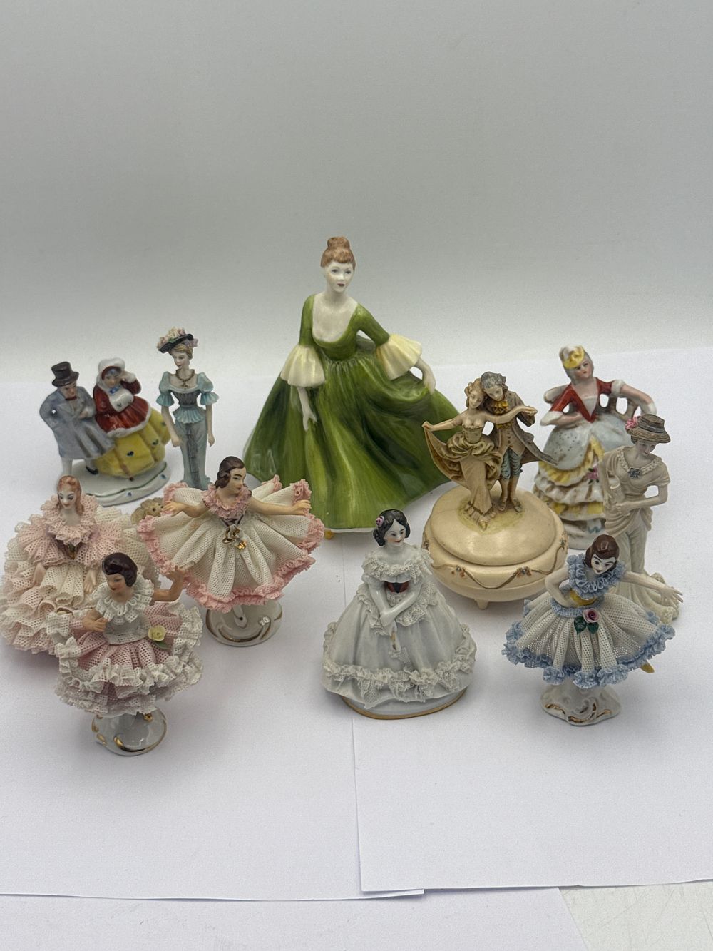 Lot 487: A Collection of Approximately Ten Coalport and Coalport Style Porcelain Figures