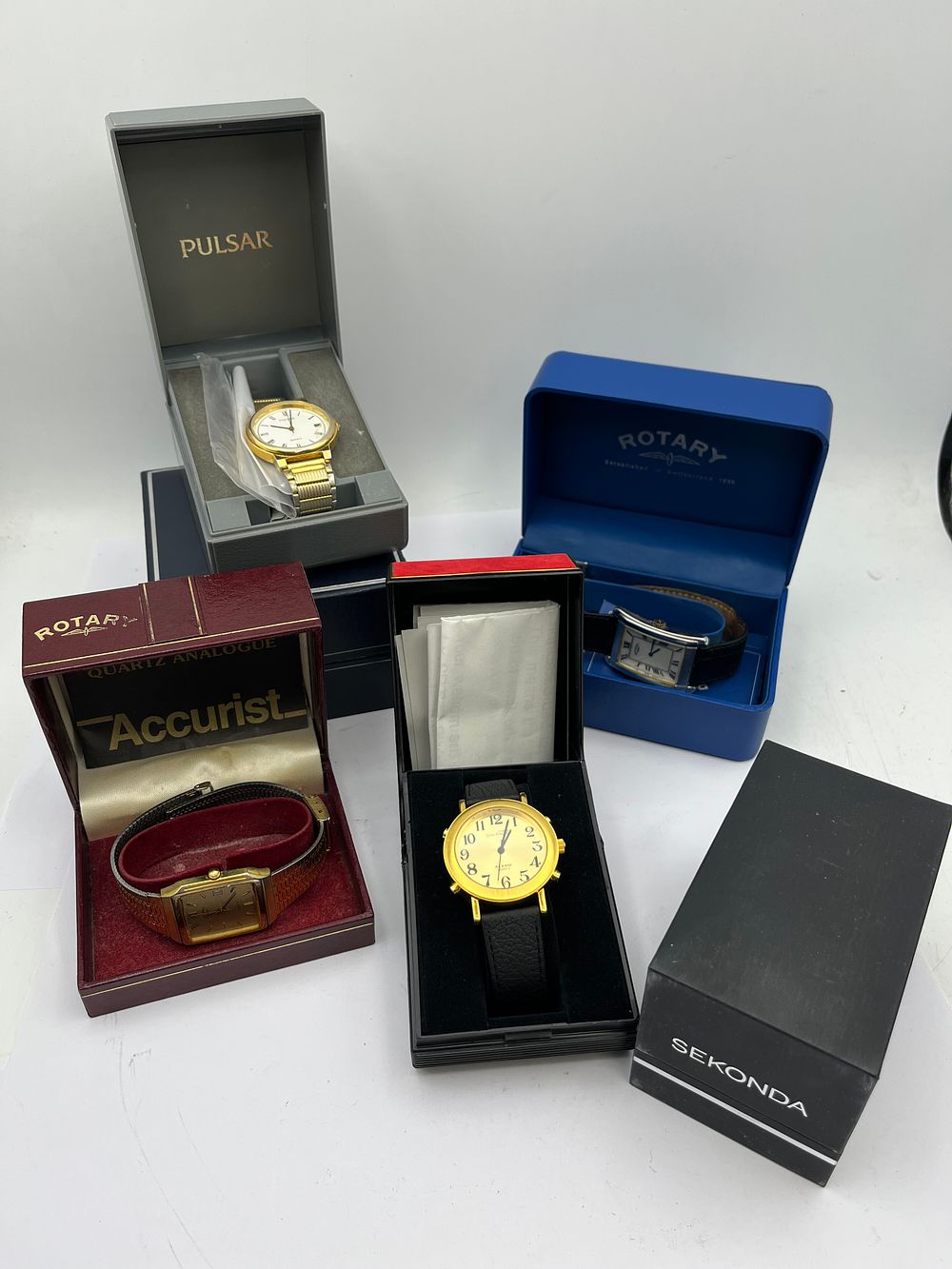 Lot 492: A Collection of Four Modern Quartz Analogue Wristwatches, including Pulsar, Accurist, and Rotary
