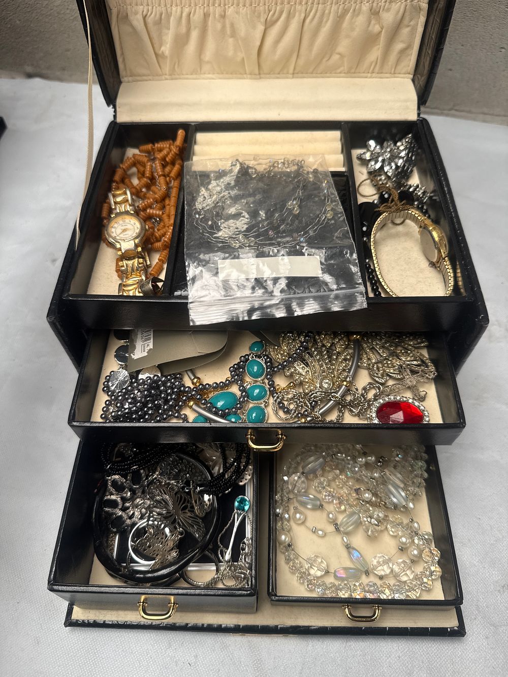 Lot 499: A Black Faux Crocodile Jewelry Box with a Collection of Costume Jewelry