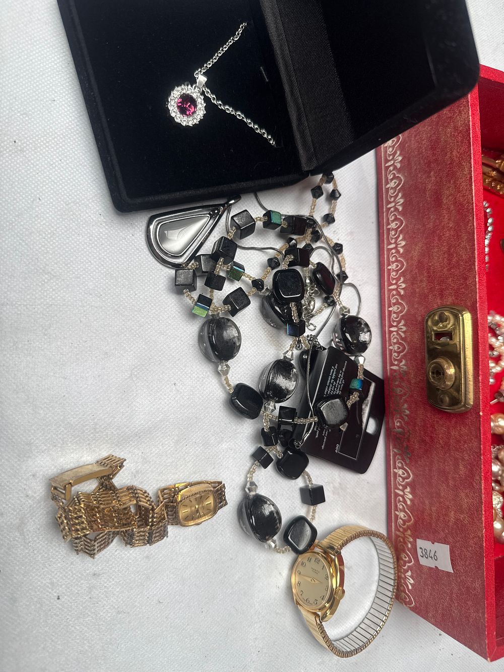 Lot 500: A Mid-to-Late 20th Century Red Velvet Jewelry Music Box with Assorted Costume Jewelry
