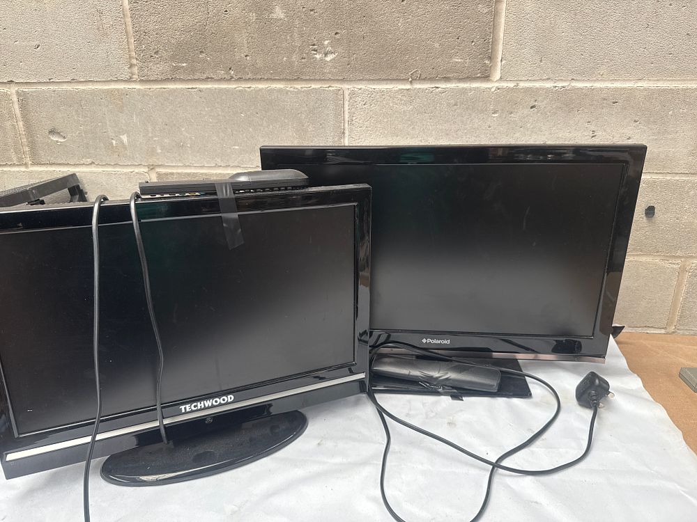 Lot 503: A Pair of Techwood and Polaroid 21" and 18" LCD Flat-Screen Televisions