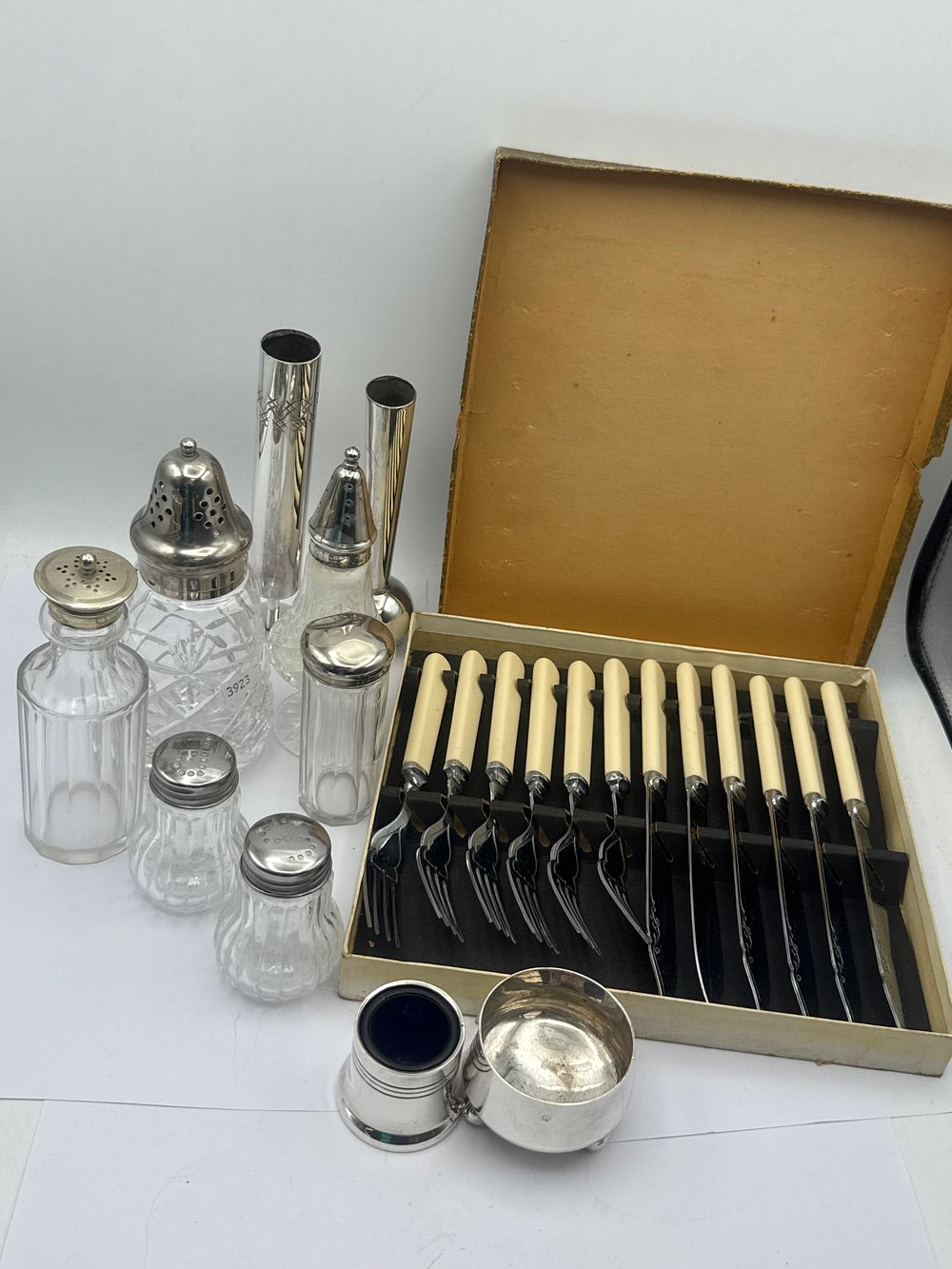 Lot 507: A Collection of Early to Mid-20th Century Cutlery, Glass Condiment Vessels, and Metalware