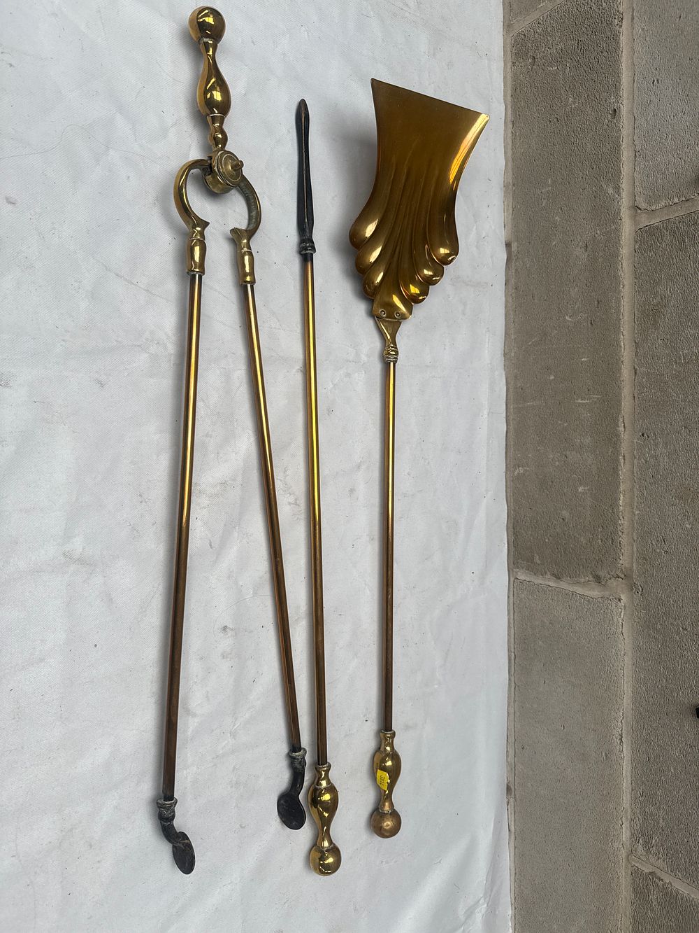 Lot 509: A Four-Piece Brass Fireplace Tool Set, 27 Inches Tall