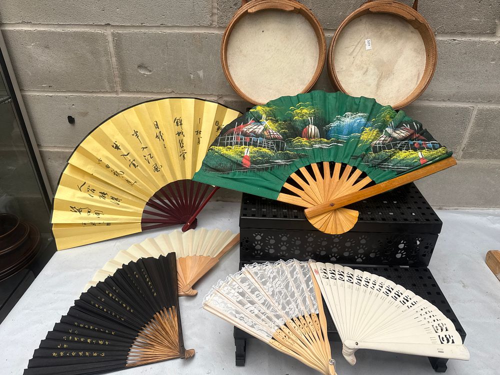 Lot 527: A Group of Decorative Folding Fans and Two Hide-Headed Drum-like Objects