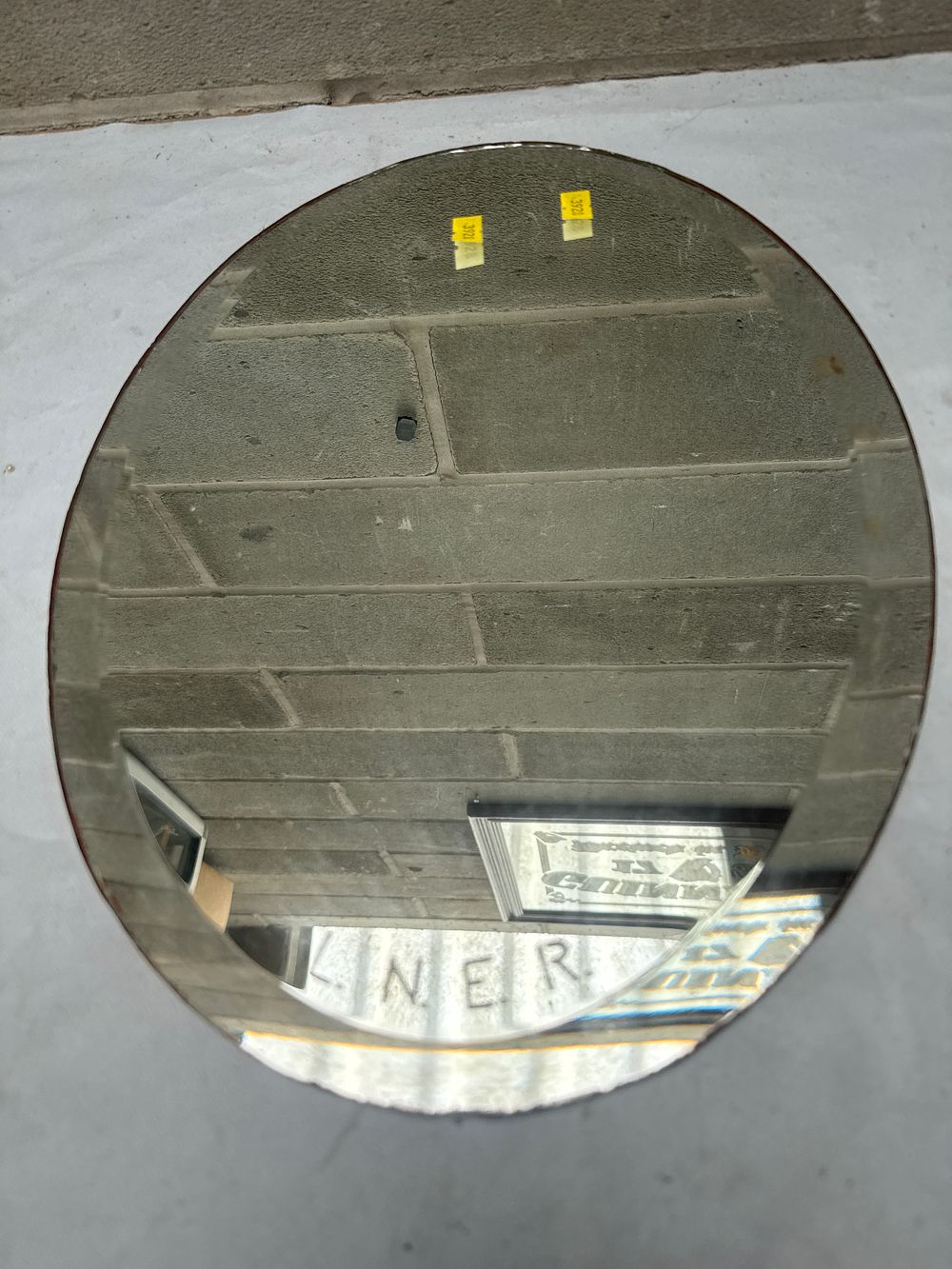 Lot 540: An LNER Oval Beveled Glass Mirror