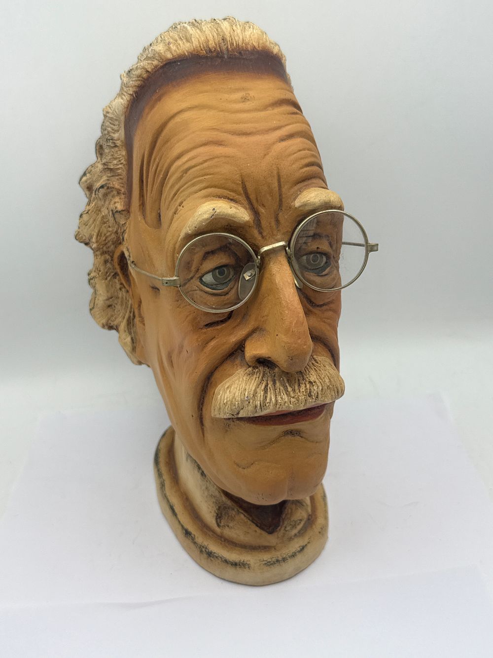 Lot 542: A Painted Resin Caricature Bust of Albert Einstein, 6.5 x 11 inches