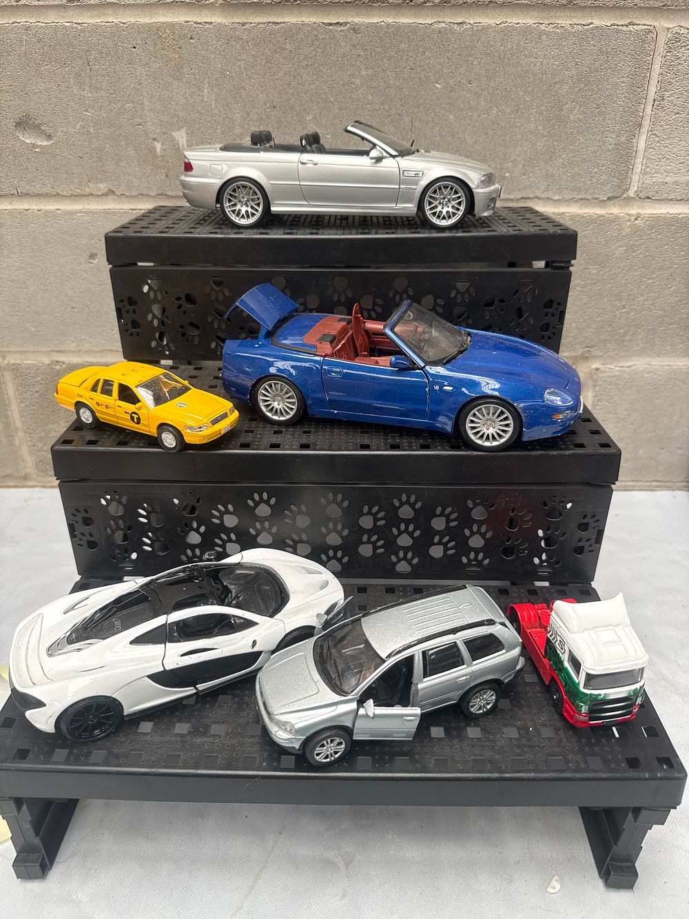 Lot 544: A Collection of Seven Assorted Die-Cast Model Vehicles, including Burago and Maisto