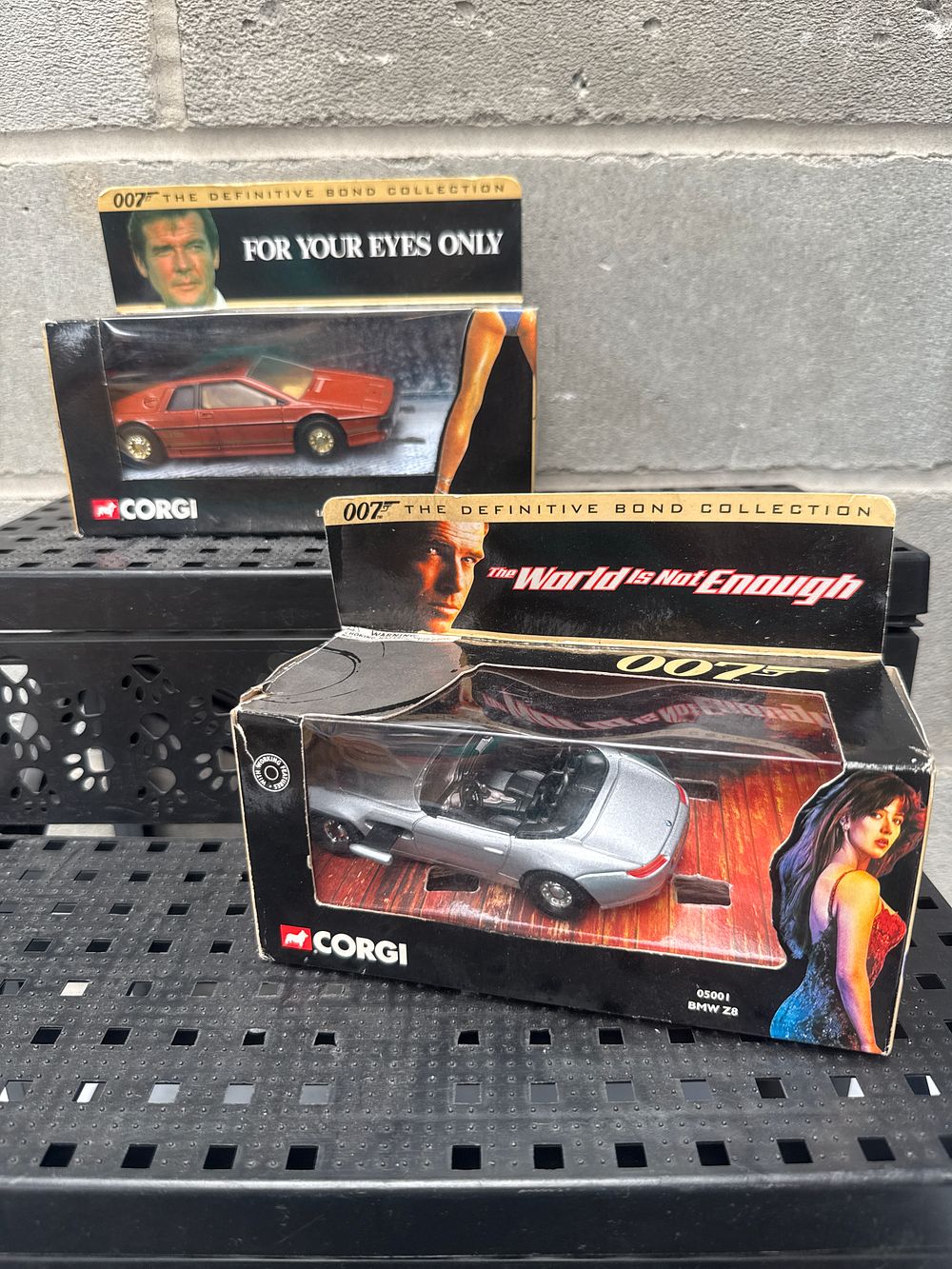Lot 549: A Pair of Corgi James Bond 007 'The Definitive Bond Collection' Die-Cast Model Cars: 'The World Is Not Enough' BMW Z8 (Model 05001) and 'For Your Eyes Only' Lotus Esprit Turbo (Model 0-701)