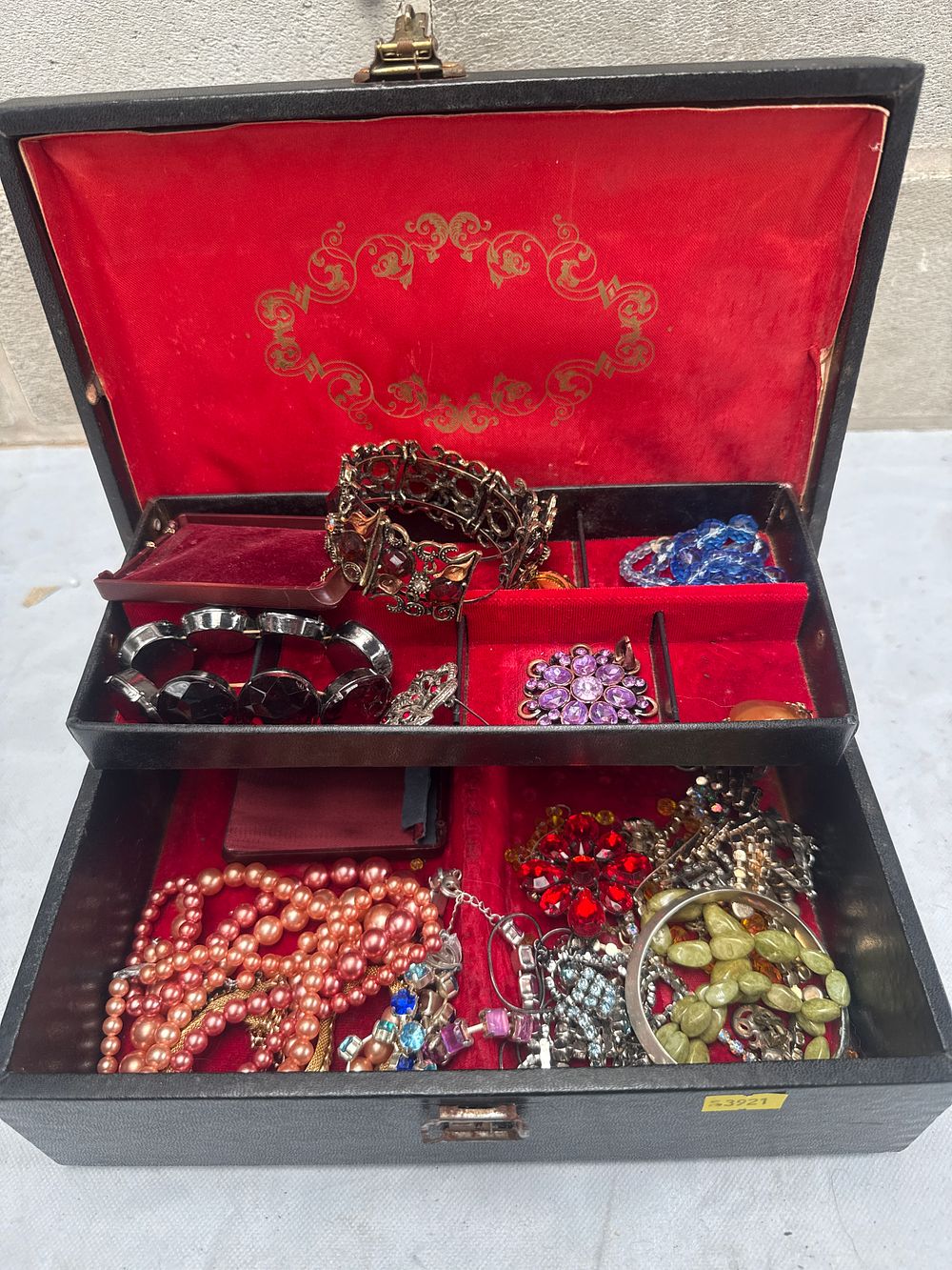 Lot 557: A Vintage Mele Two-Tiered Jewelry Box with a Collection of Costume Jewelry