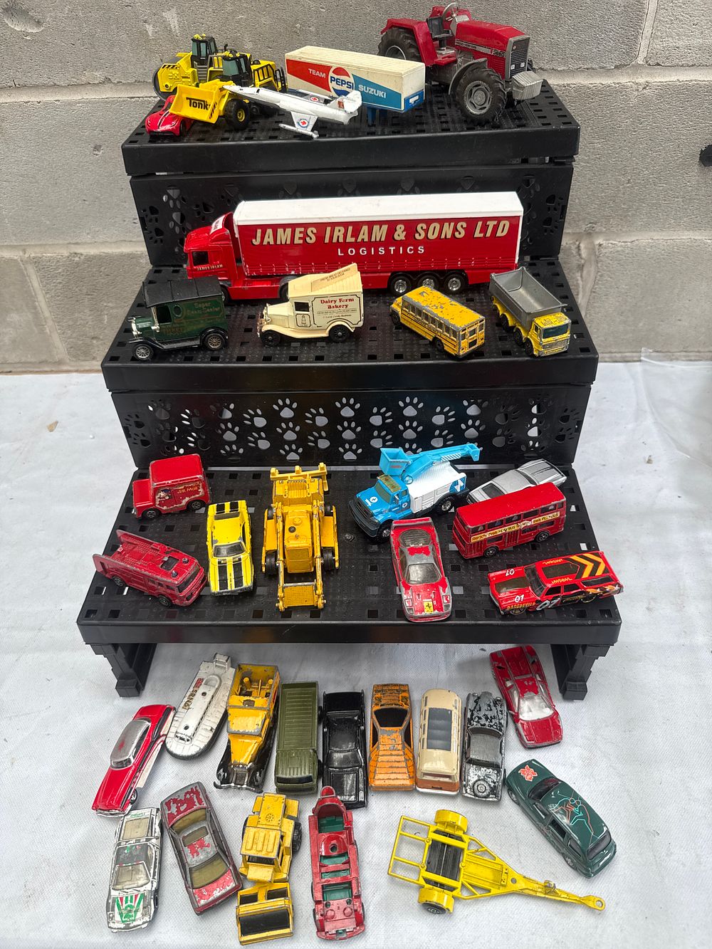 Lot 565: A Collection of Die-cast and Plastic Toy Vehicles, including Matchbox-style examples