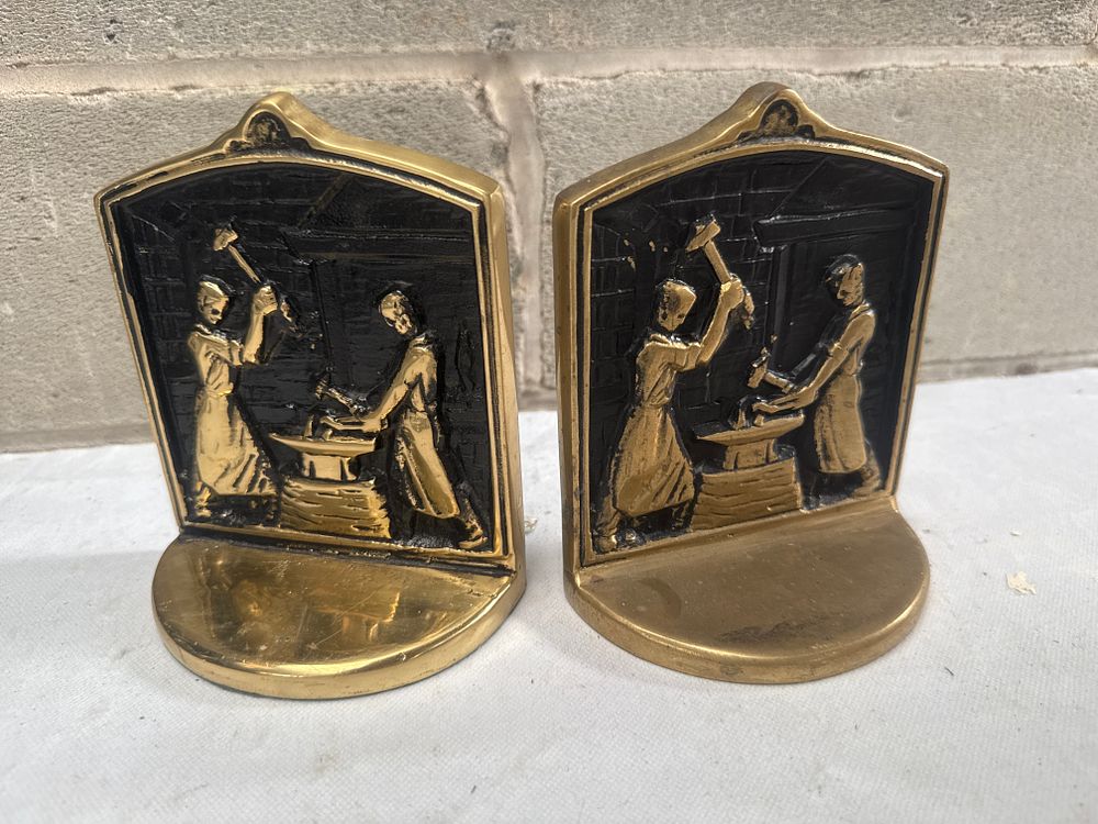 Lot 572: A Pair of Brass 'Blacksmith with Hammer and Anvil' Bookends, 6 Inches