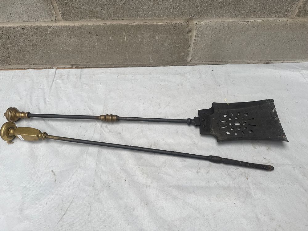 Lot 574: A Pair of Antique Brass and Iron Fireplace Tools