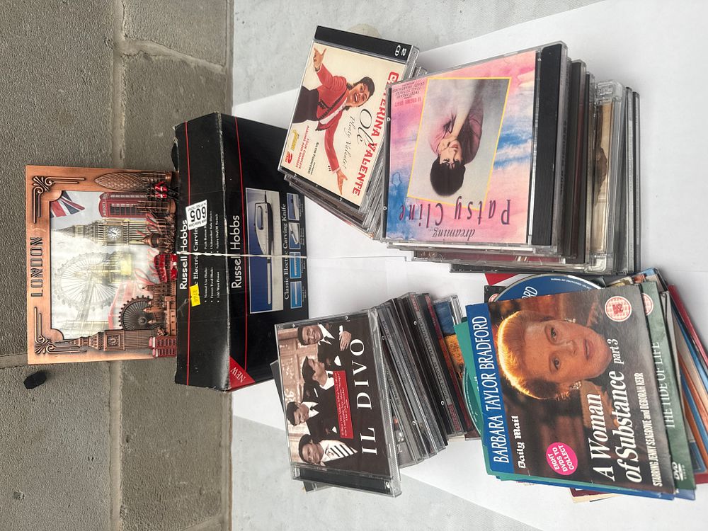 Lot 579: A Collection of Il Divo and Other Music CDs and DVDs, a Russell Hobbs Electric Carving Knife, and a London Wall Plaque