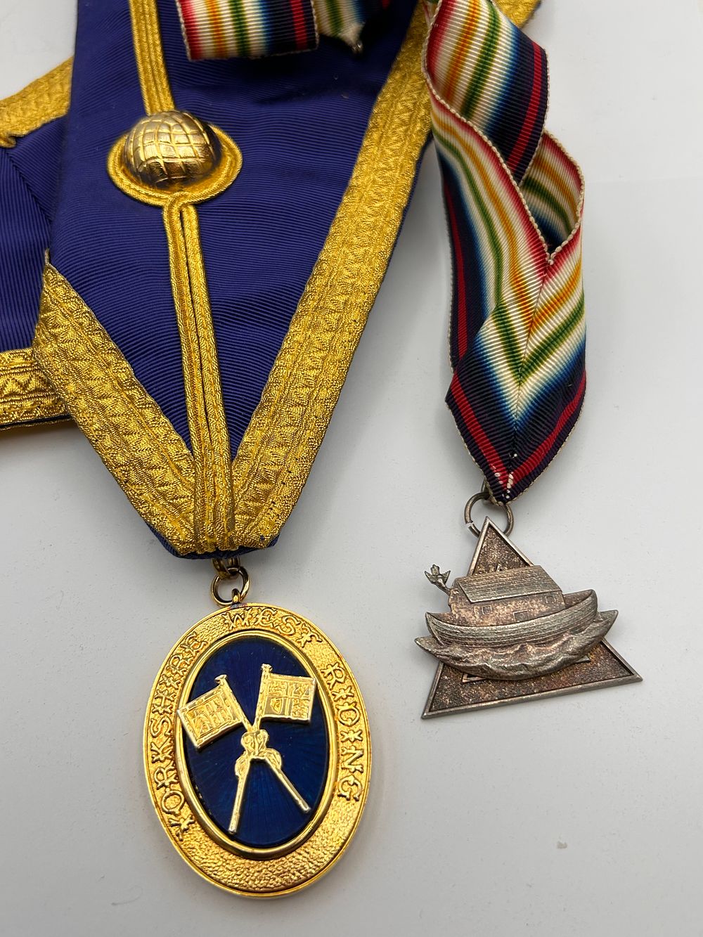 Lot 585: A Pair of Masonic Regalia: Gilt and Enamel Supreme Grand Chapter Collar Jewel with Sash, and a Triangular Longship Medal
