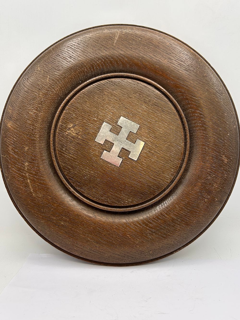 Lot 595: Antique English Circular Wooden Bread Board with Central Silver Cross Inlay