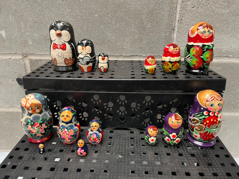 Lot 610: A Collection of Russian Matryoshka Nesting Dolls and a Set of Penguin Nesting Dolls, Tallest 4”