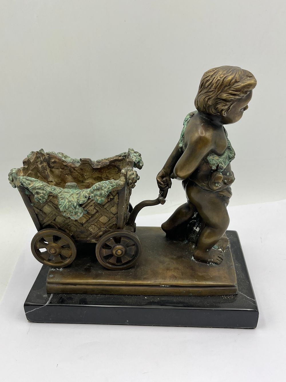 Lot 613: J. Rousseau, A Late 19th/Early 20th Century Bronze Figural Sculpture of a Putto Pulling a Cart, on Marble Base