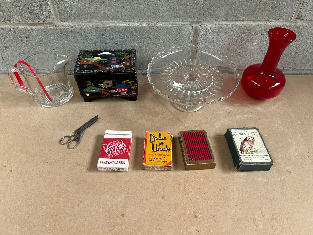 Lot 646: A Collection of Vintage Decorative and Game Items, including a Pressed Glass Cake Stand, Lacquered Box, and Card Games