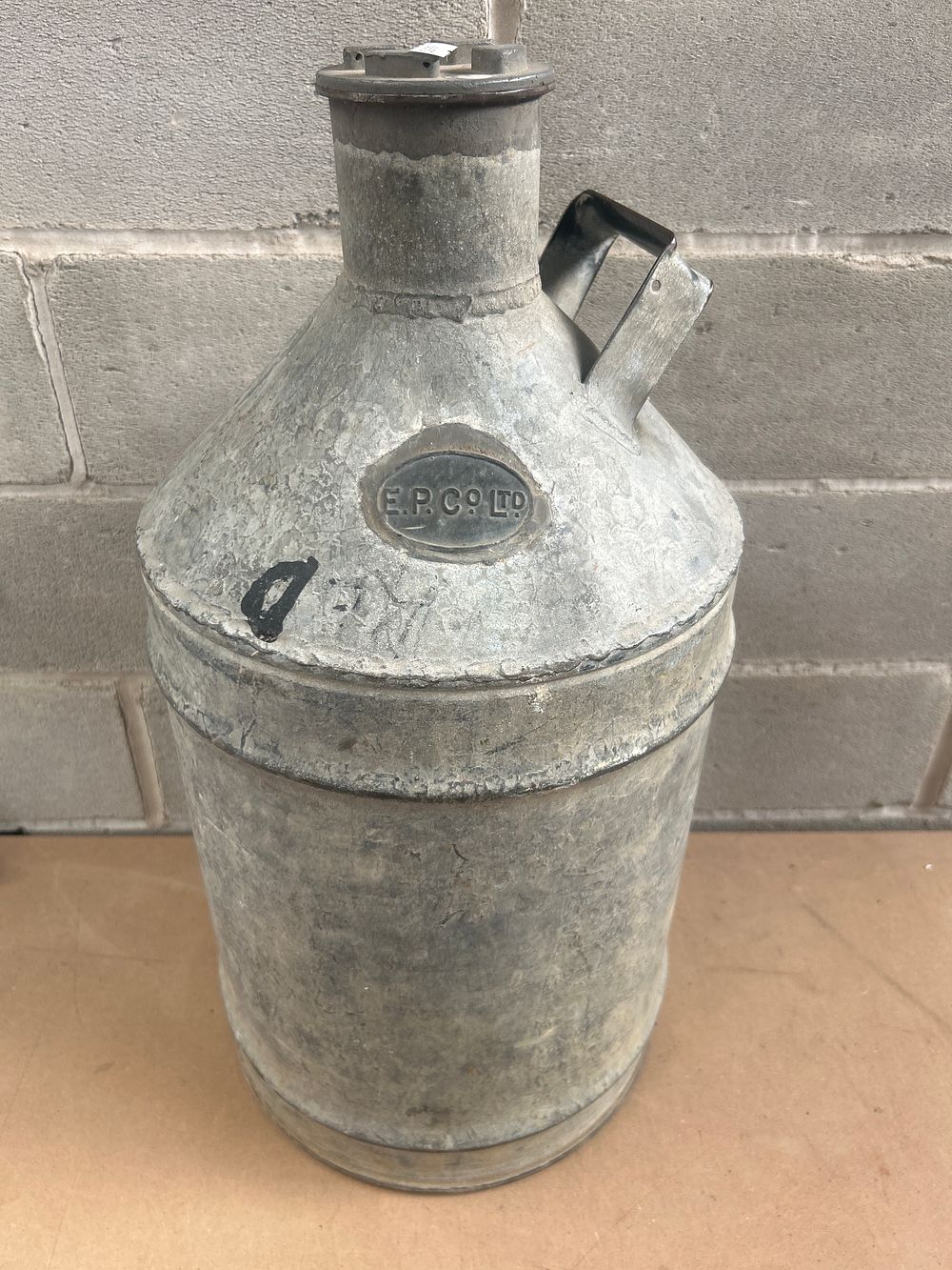 Lot 660: A 23” Tall Galvanized Metal Milk Can, E.P. CO. LTD