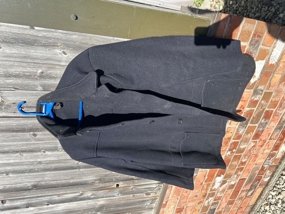 Lot 679: A Stenciled Dark Wool Utility Jacket, likely National Coal Board (NCB)