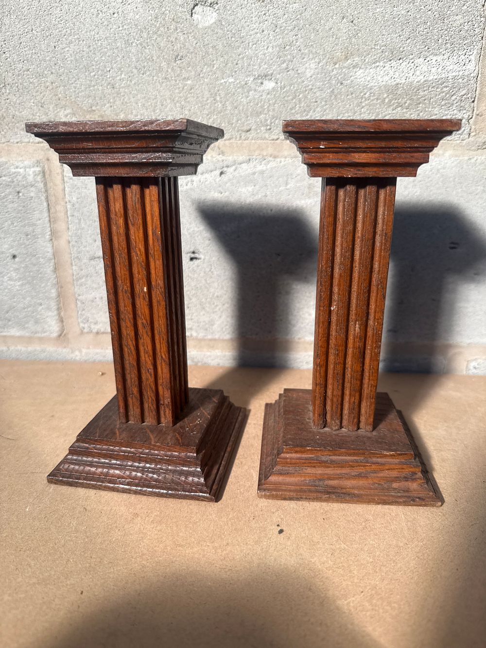 Lot 322: A Pair of Georgian Style Oak Fluted Column Candlesticks