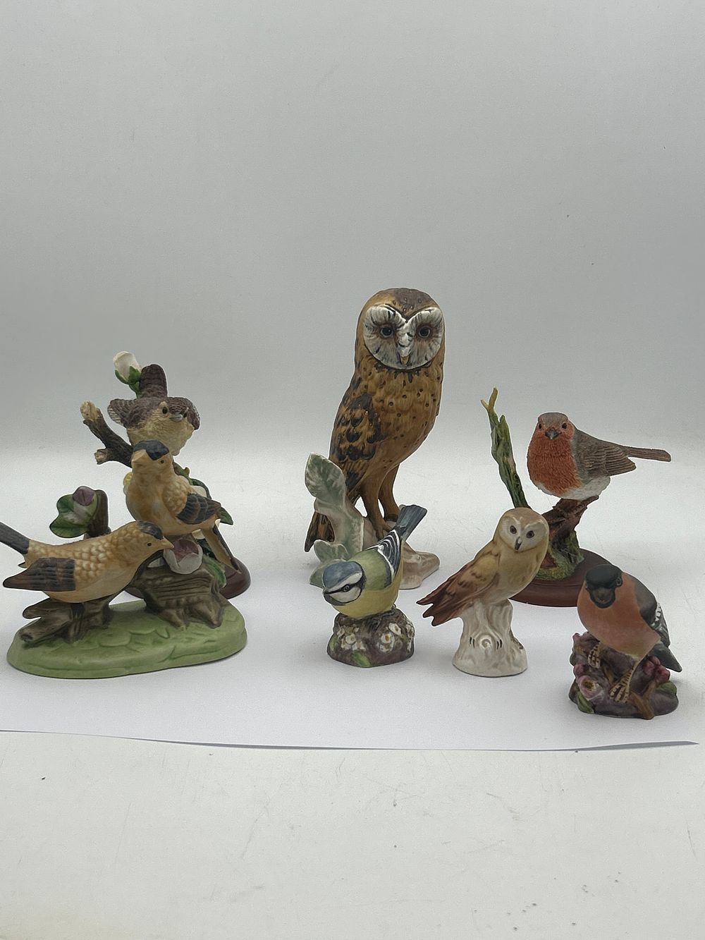 Lot 617: A Collection of Ceramic Bird Figurines, including Goebel and Royal Worcester