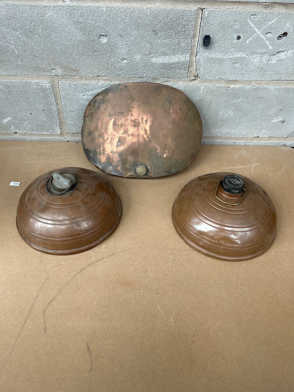 Lot 618: Three Vintage Copper and Brass Bed Warmers, including a 'WAFAX' example