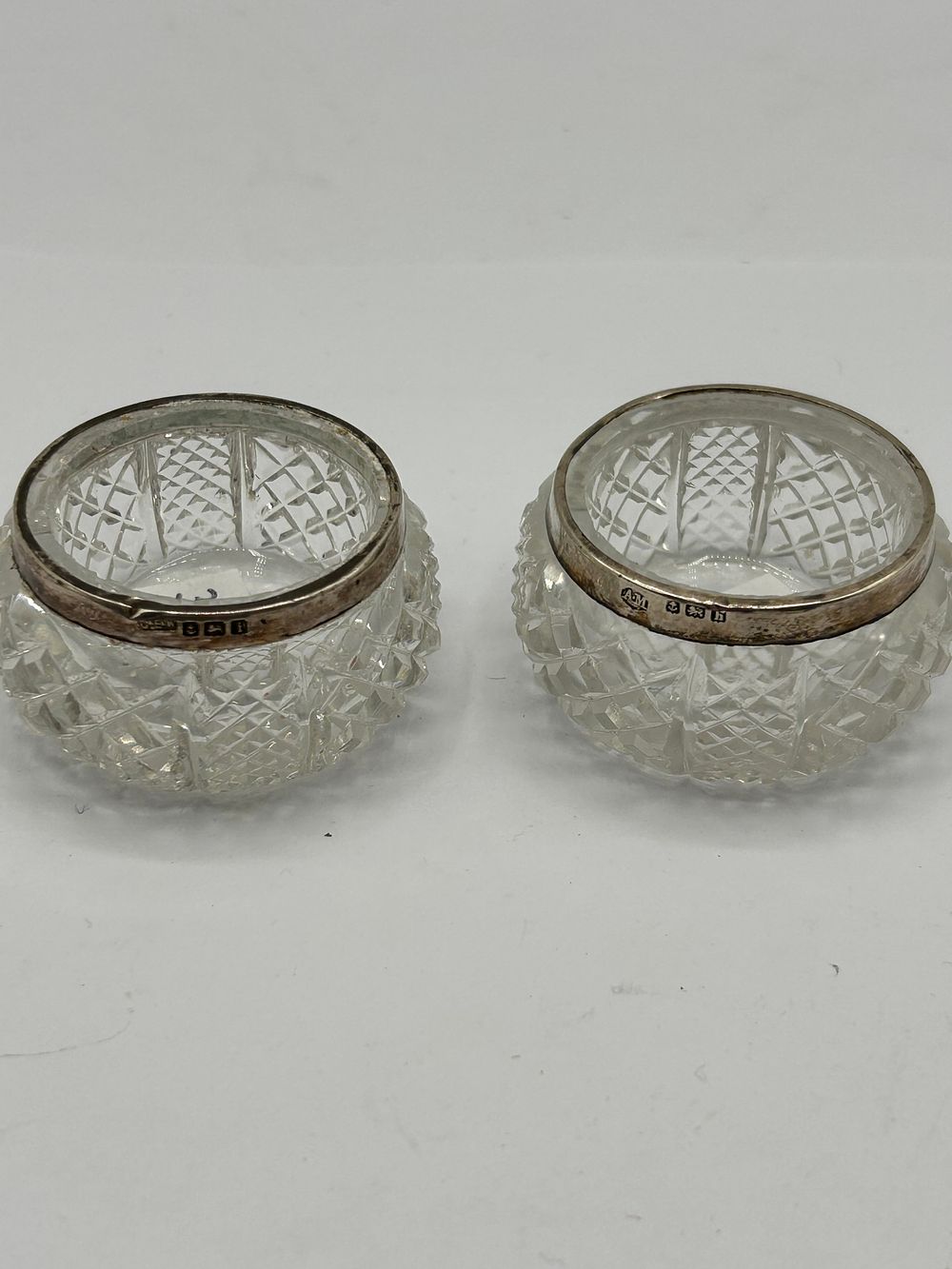 Lot 313: A Pair of Early 20th Century Hallmarked Sterling Silver-Rimmed Cut Glass Open Vessels