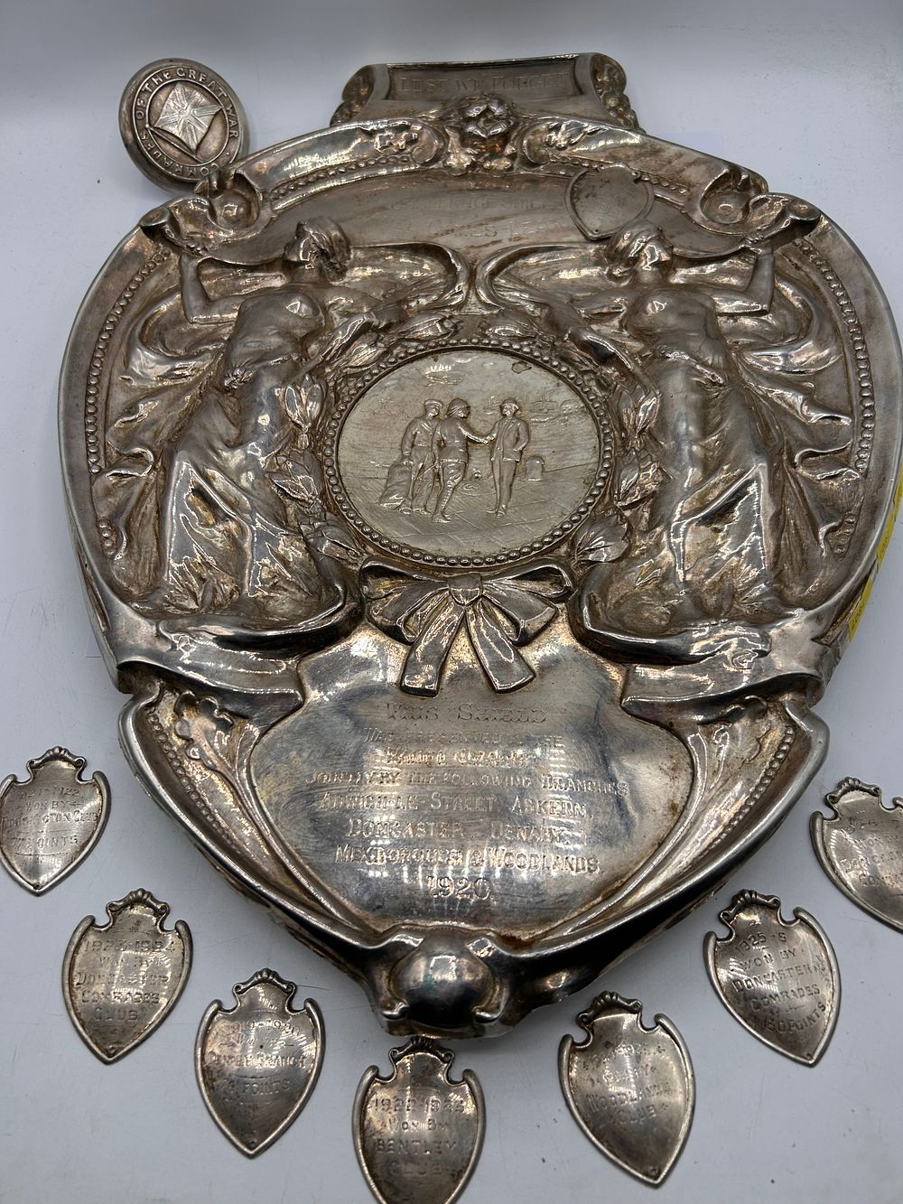 Lot 323: An Early 20th Century Doncaster & District Panel Games League Challenge Shield with a Group of Winner Plaques 18"x13"