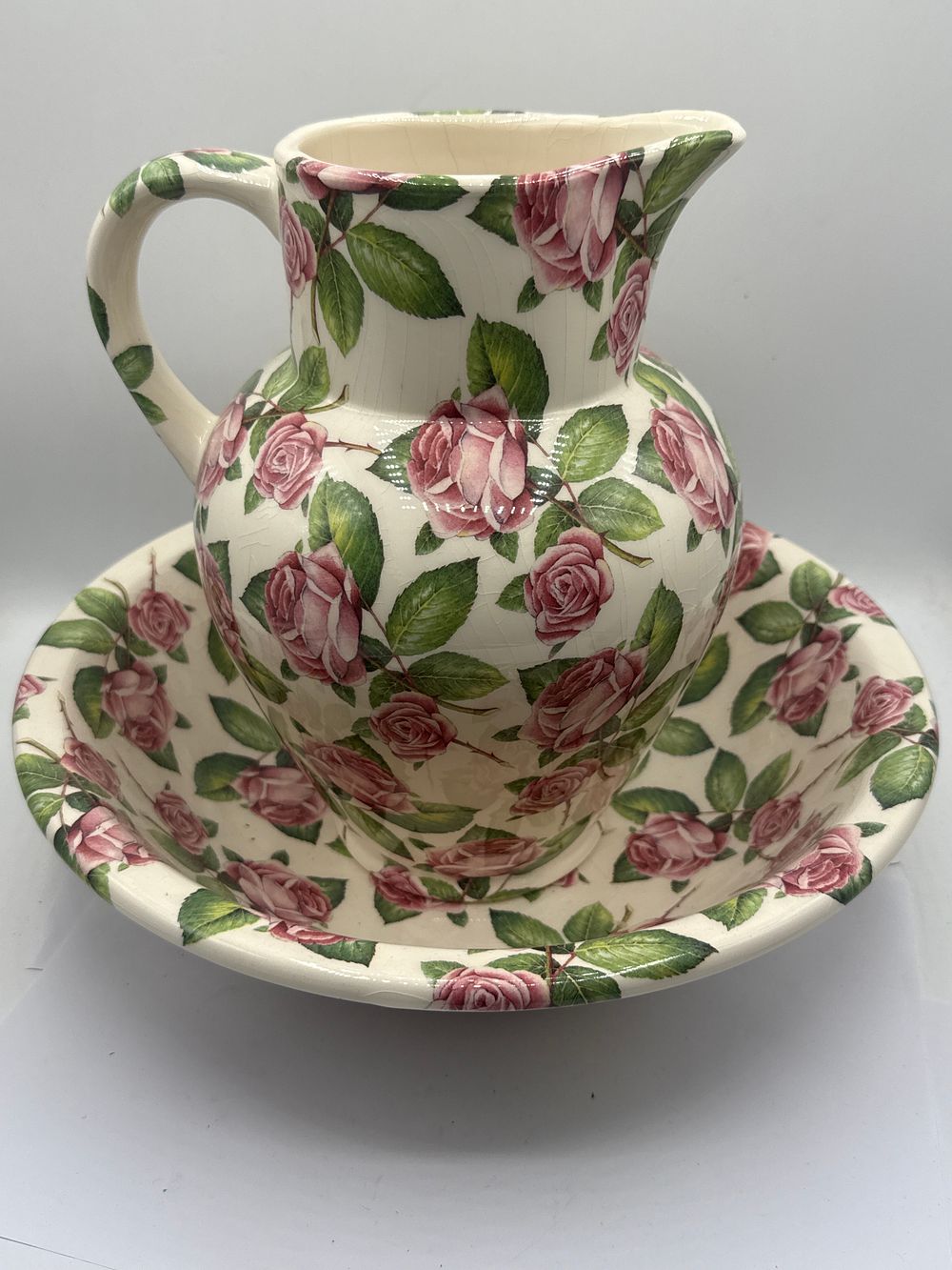 Lot 332: A Bristol China Company Ceramic Wash Set, decorated with Pink Roses, the jug standing 12”