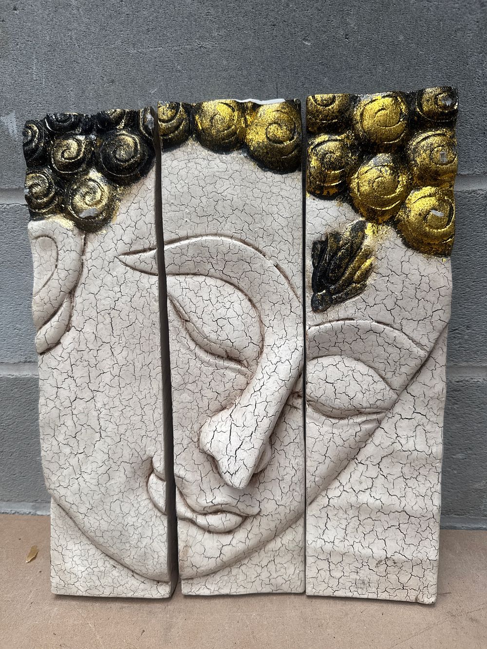 Lot 334: Gold and Black Accented Crackle Buddha Face Three-Panel Wood Wall Art, Each Panel 4 x 15 Inches