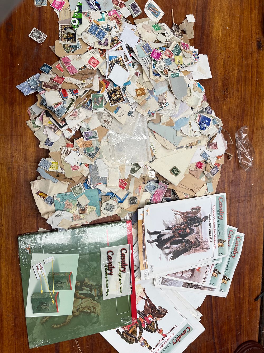 Lot 337: A Collection of Unsorted Worldwide Postage Stamps (Kiloware) and Military History Magazines