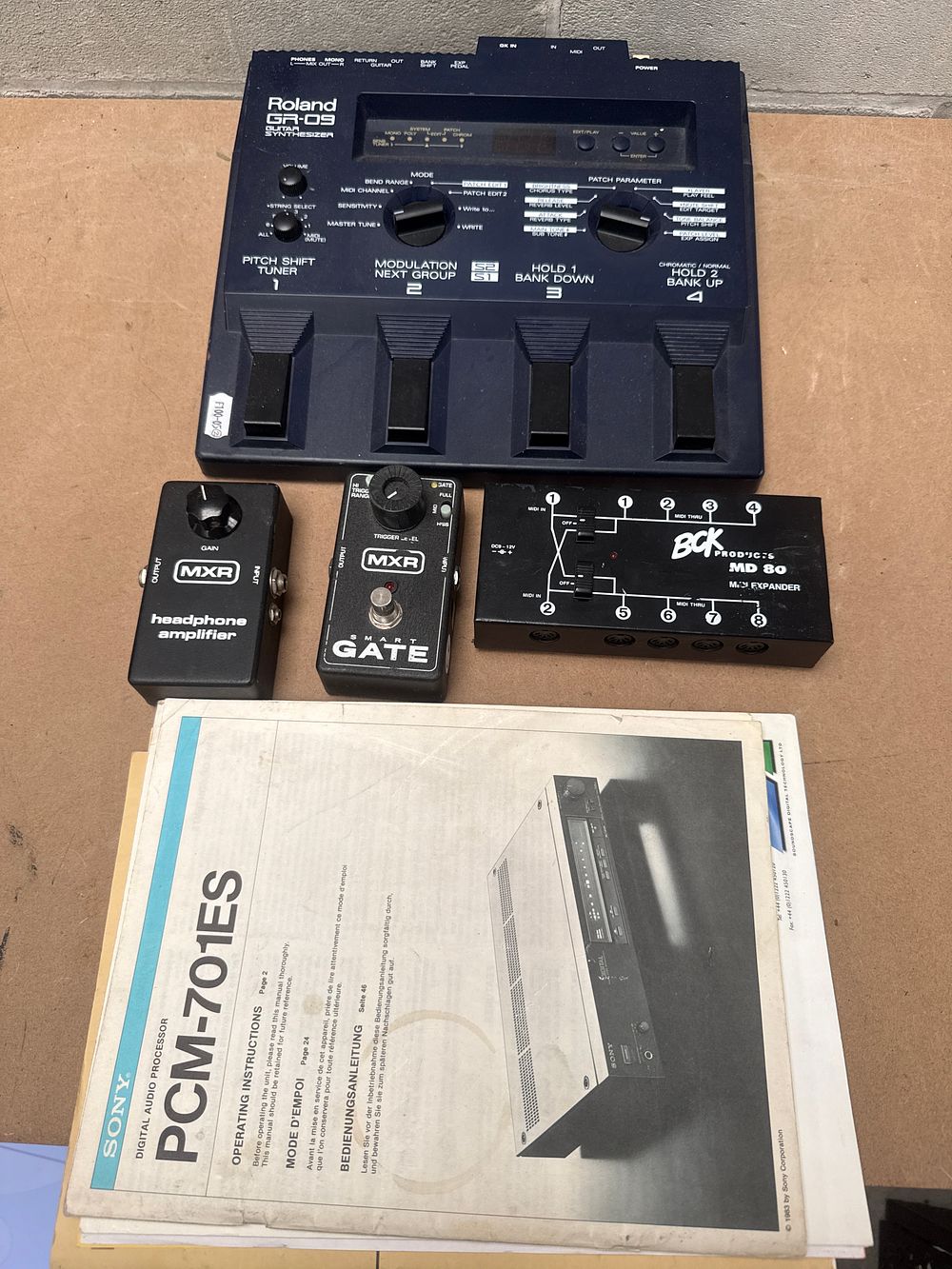 Lot 339: A Collection of Vintage Electronic Music Equipment, including a Roland GR-09 Guitar Synthesizer and a Sony PCM-701ES Digital Audio Processor Manual