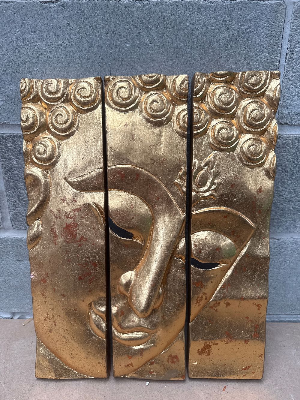Lot 359: A Three-Panel Golden Buddha Face Carved Wood Wall Art, Each Panel 4 x 15 Inches