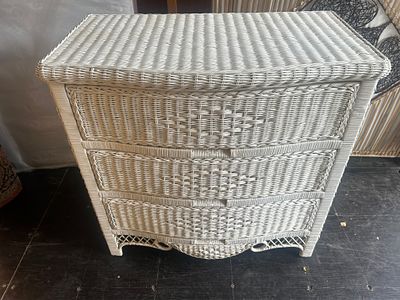 A White-Painted Wicker and Rattan Bow-Front Three-Drawer Chest 34 x 33.5 x 19.5". A 