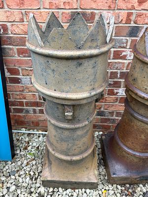 A Crown Chimney Pot, 42 Inches Tall, crafted from what appears to be salt-glazed terracotta or 