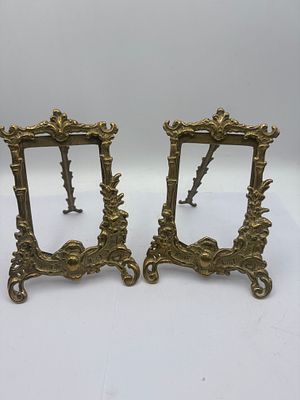 A Pair of Art Nouveau Brass Easel-Back Picture Frames. A pair of Art Nouveau brass easel-back 