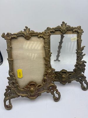 A Pair of Rococo Brass Photo Frames. A pair of Rococo-style brass photo frames. Crafted from 