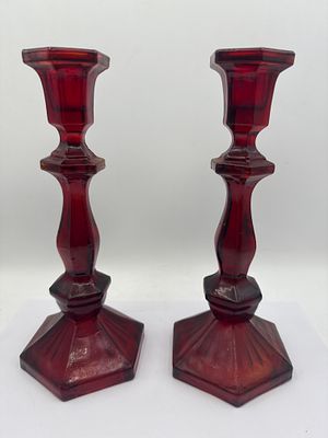 A Pair of Faceted Red Glass Candlesticks, Standing 9”. This lot comprises a pair of identical 