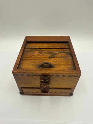 Japanese Folk Art Wooden Puzzle Dispenser Box, Early 20th Century. This rectangular wooden box 