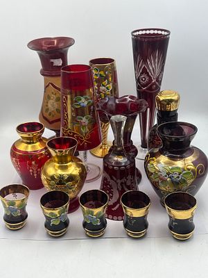 A Collection of 16 Bohemian Cranberry and Polychrome Enamel Gilt Glass Vessels. A collection of 